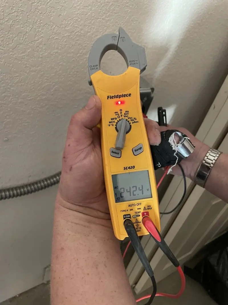 Voltage testing with clamp meter during Hot Tub / Pool Electrical Wiring in Barrington